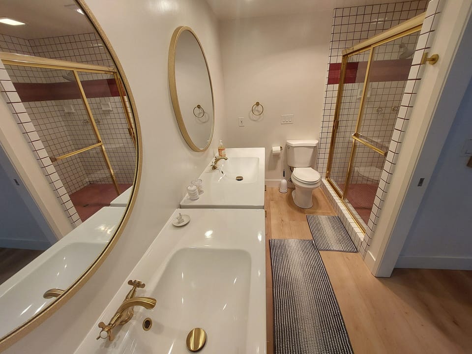 Modern downstairs bathroom with walk-in shower and fresh design.