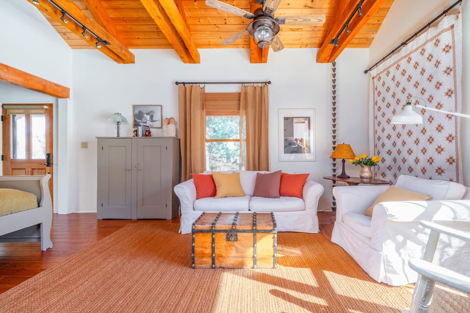 Seating area in LR. Cabinet stores extra blankets. Pictured is front entrance. 