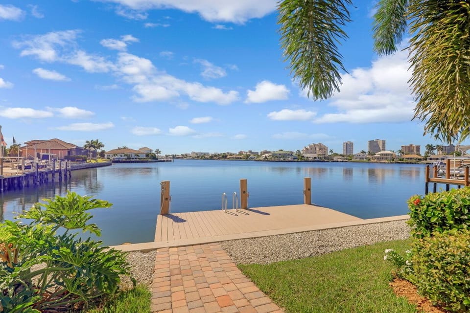 Dock on Landmark Bay with Marco Skyline by day and by night