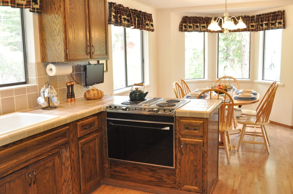 Main kitchen, table extends to seat 8.