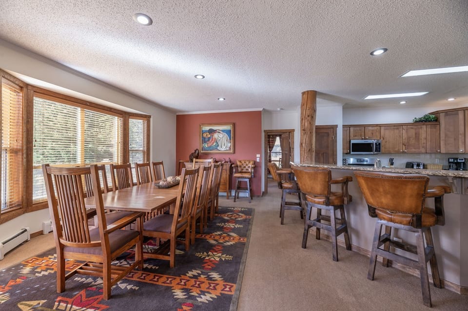 House seats 22 for meals--12 at main table, 6 at eating bar, and 4 at game table