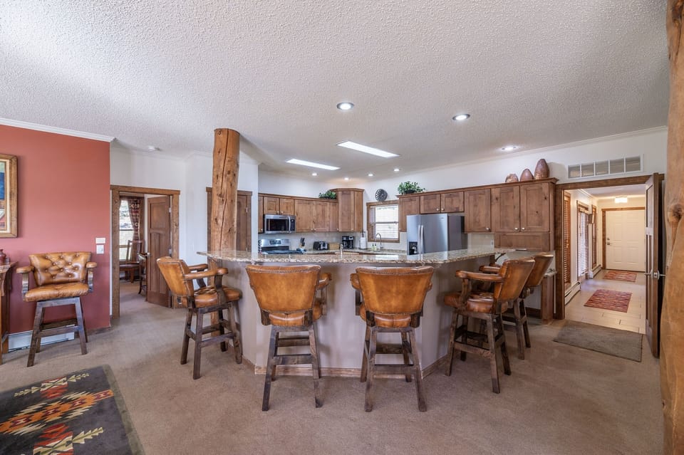 Main kitchen (counter seats 6; extra bar stools in nearby rooms)