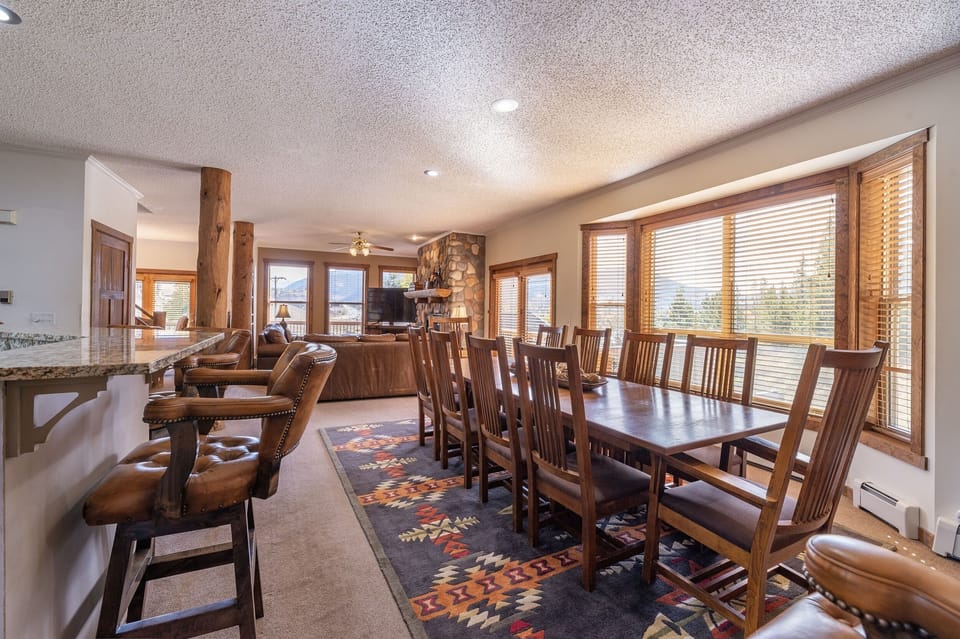 Dining room and kitchen area have the same mile-wide views as rest of house.