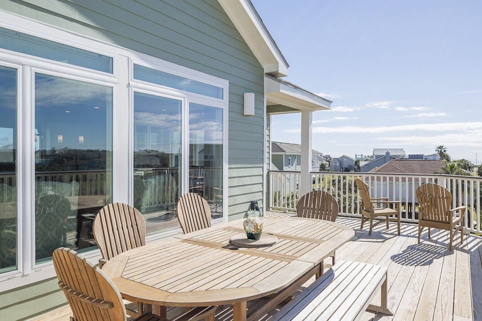 SECOND FLOOR DECK WITH VIEW OF THE GULF, NOW HAS A PARTIAL SHADED LOUVERED COVER