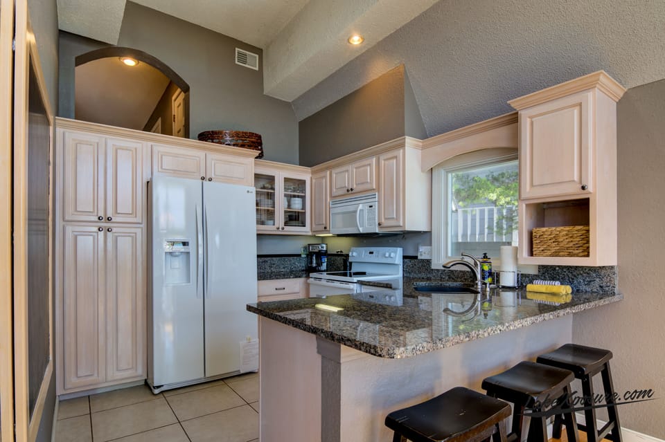 Nice airy kitchen opens to dining room.