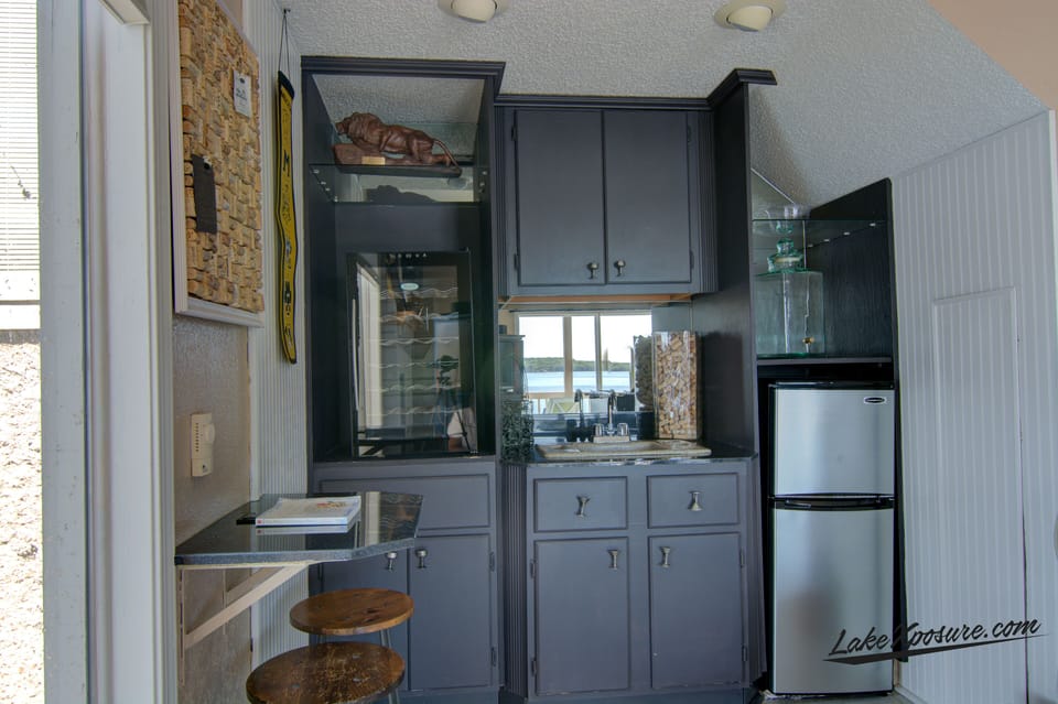 Wet bar in downstairs game room. Just steps from the lower deck and pool