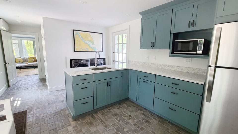 Kitchenette with refrigerator and microwave