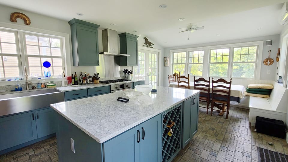 Kitchen with granite counter tops and large center island