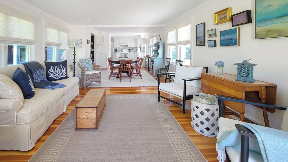 Bright and comfortable family room with dining area and kitchen beyond
