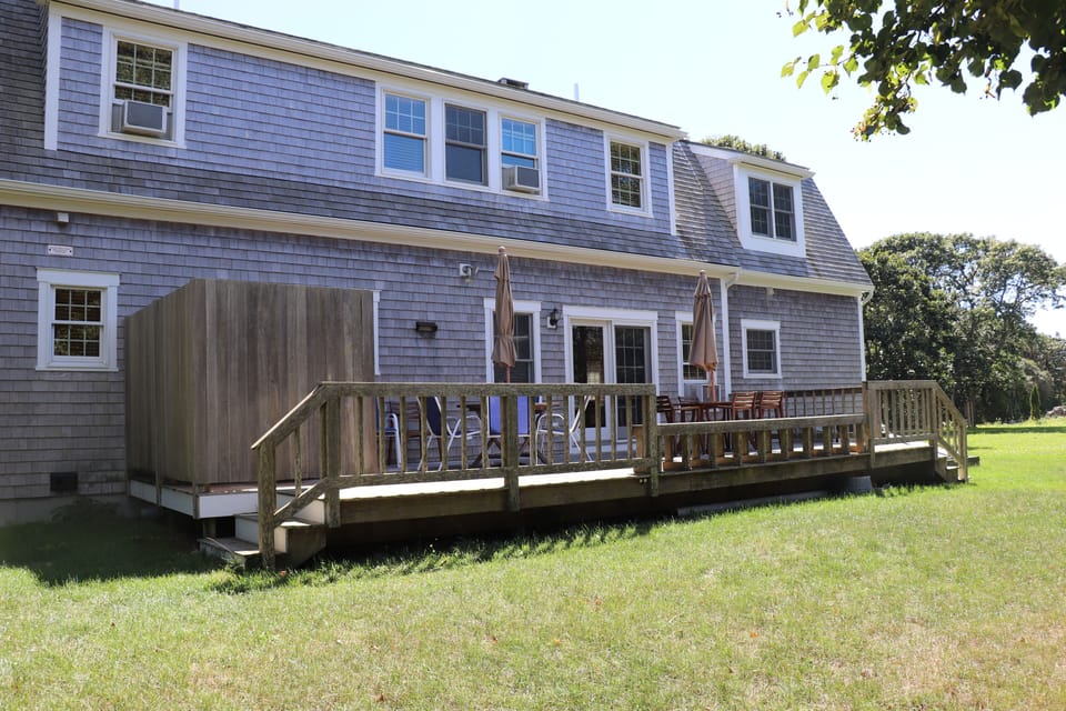 Back deck with enclosed outdoor shower.