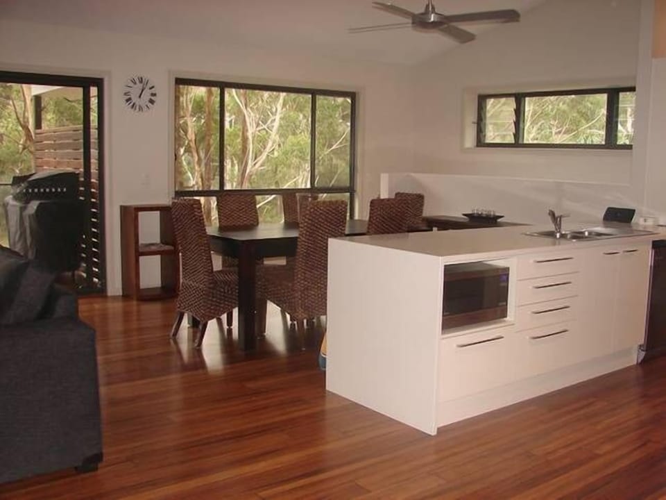 Open plan living, affords lake views from the kitchen, dining and living areas. 