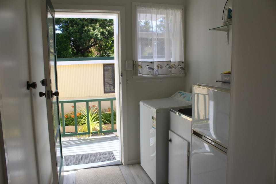 Laundry with spare fridge/freezer
