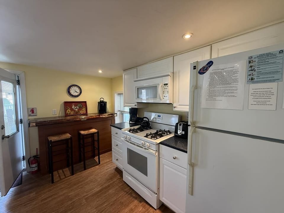 Kitchen door leads out to backyard for easy grilling and access to parking 