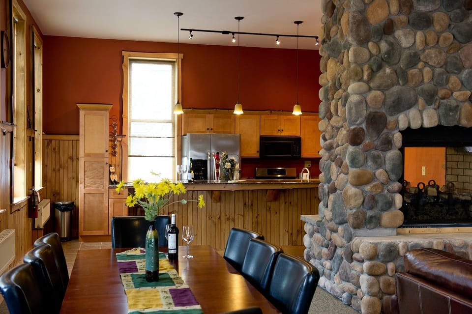 Fireplace and kitchen open up to the dining area and great room.