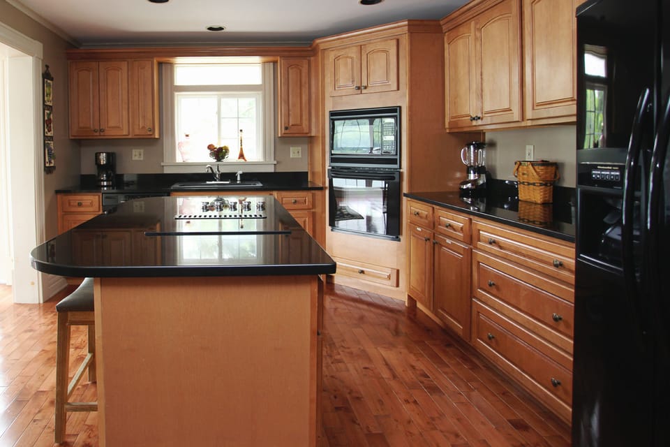 Kitchen with stovetop, oven, microwave, dishwasher, and refrigerator.