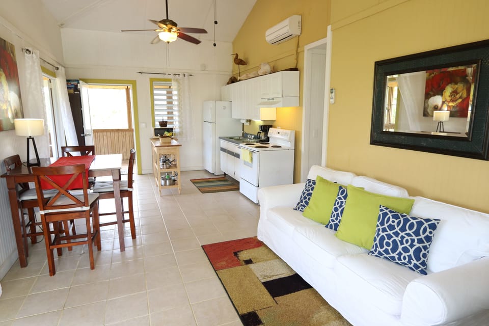 Spacious living room opens to the 50Ft. screened in porch!