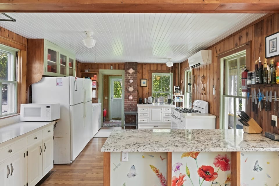 Kitchen with large island and 2 full refrigerators