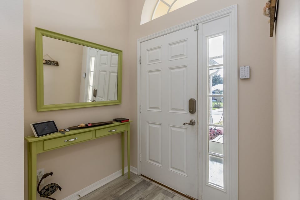 Entryway Front Door with keypad lock and small screened-in porch