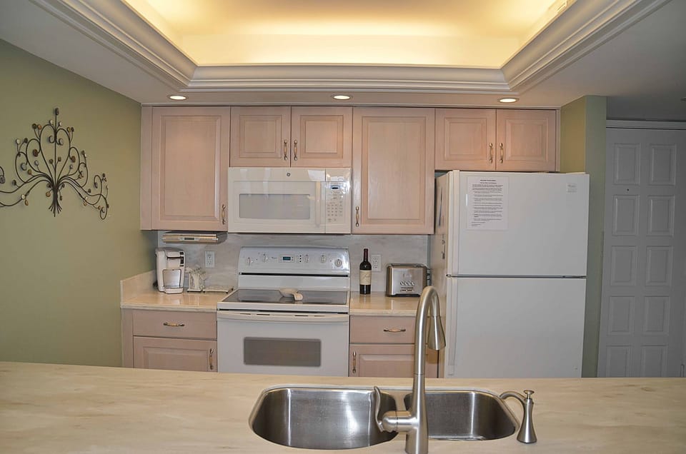 Kitchen with dramatic tray ceiling.