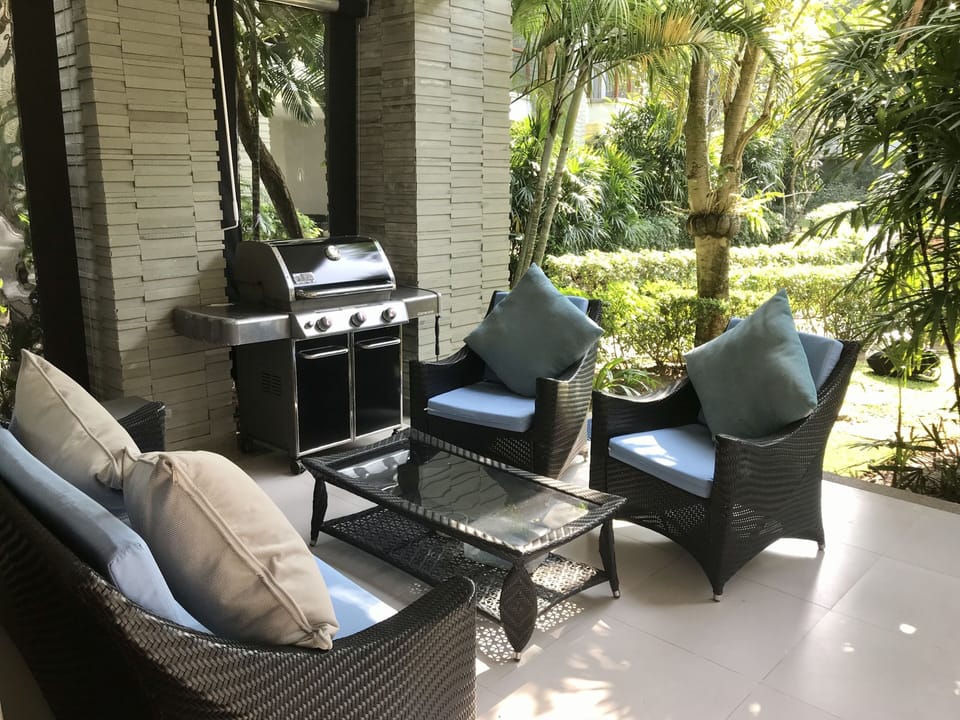 Patio with furniture and BBQ.