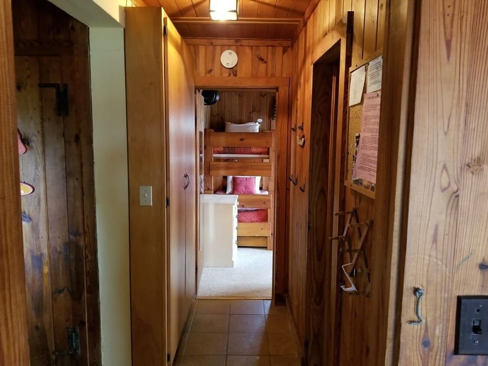 Hallway with bathroom on right