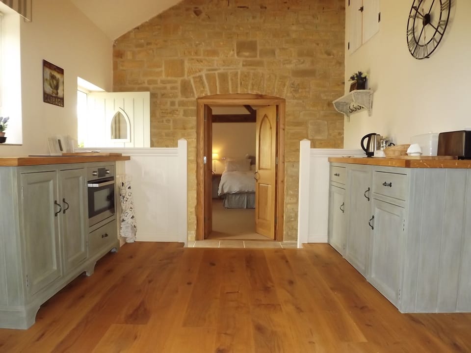 The fully equipped hand painted kitchen was made in our own workshop on site