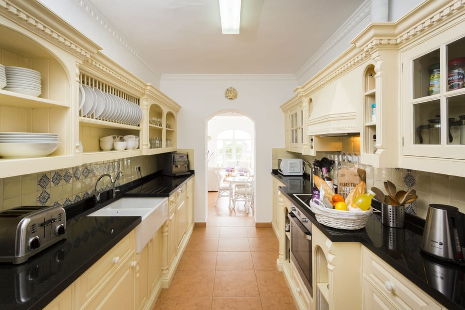 Kitchen with all cooking essentials, coffee machine, filtered water and basics