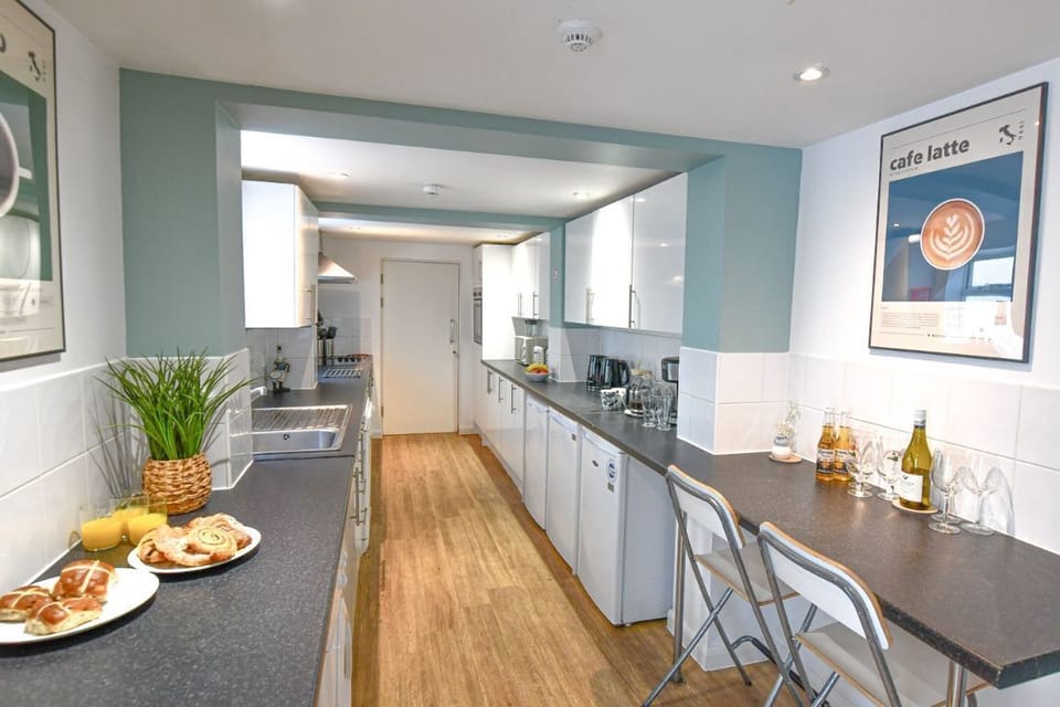 Large self-catering kitchen with two ovens and multiple fridges