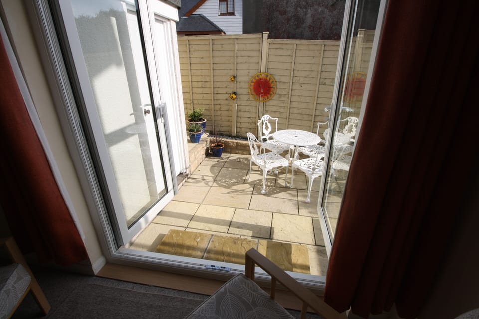 French doors lead onto the sunny patio