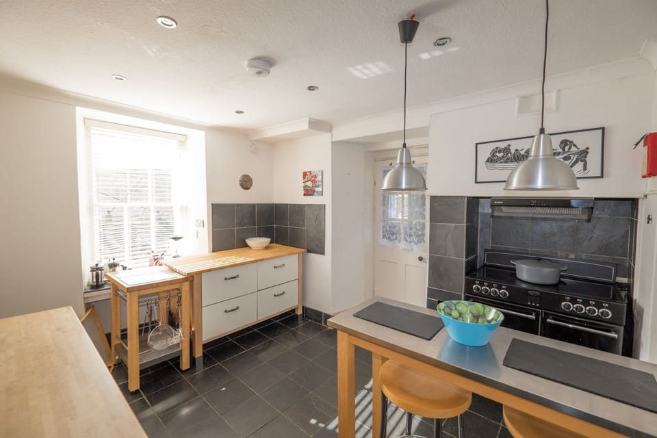Trethoway, Port Isaac. Ground floor: The superbly equipped kitchen with a range cooker, small breakfast bar, dishwasher, large fridge and separate freezer.