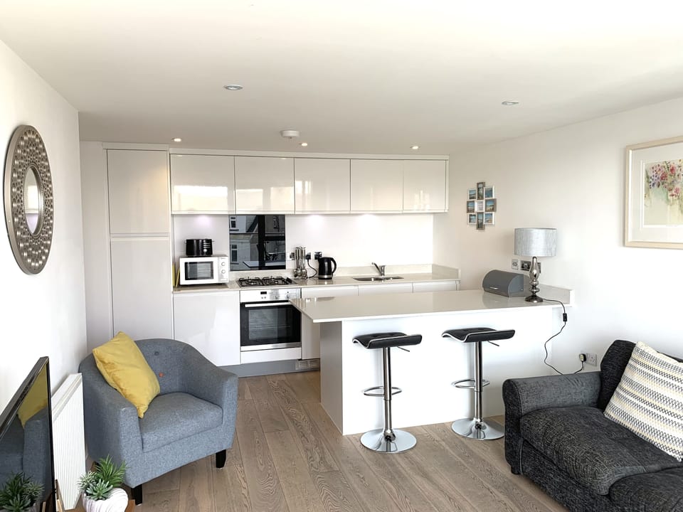 Open plan kitchen lounge with balcony