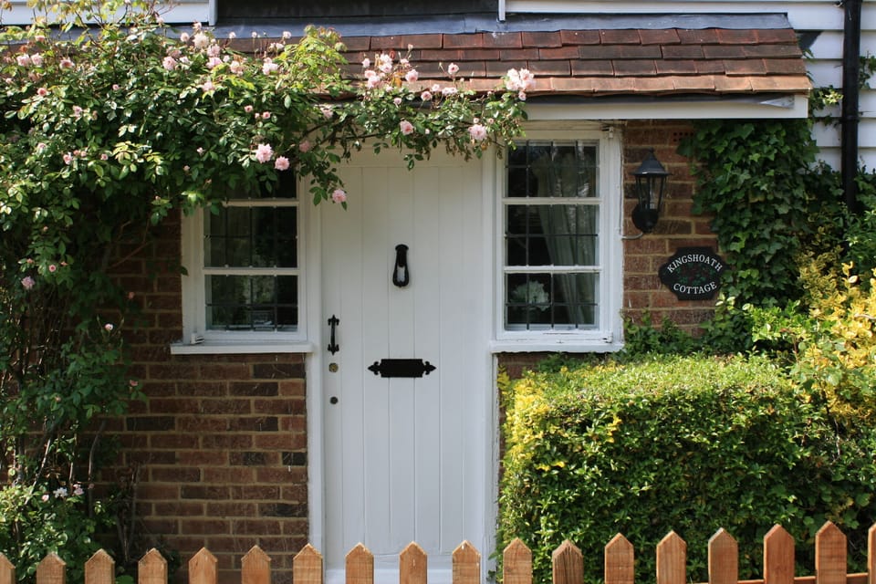 Kingshoath Cottage front door surrounded by roses