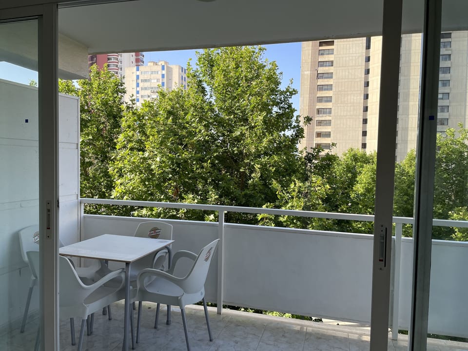 Table and four chairs on balcony