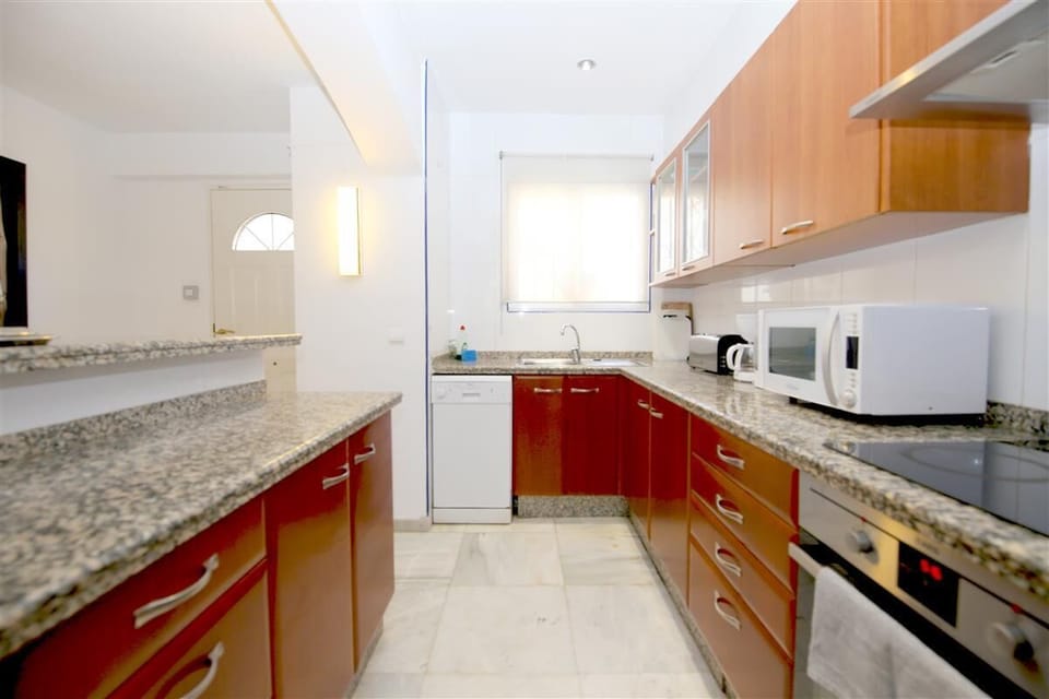 Another picture of the open kitchen with serving bar from a different angle