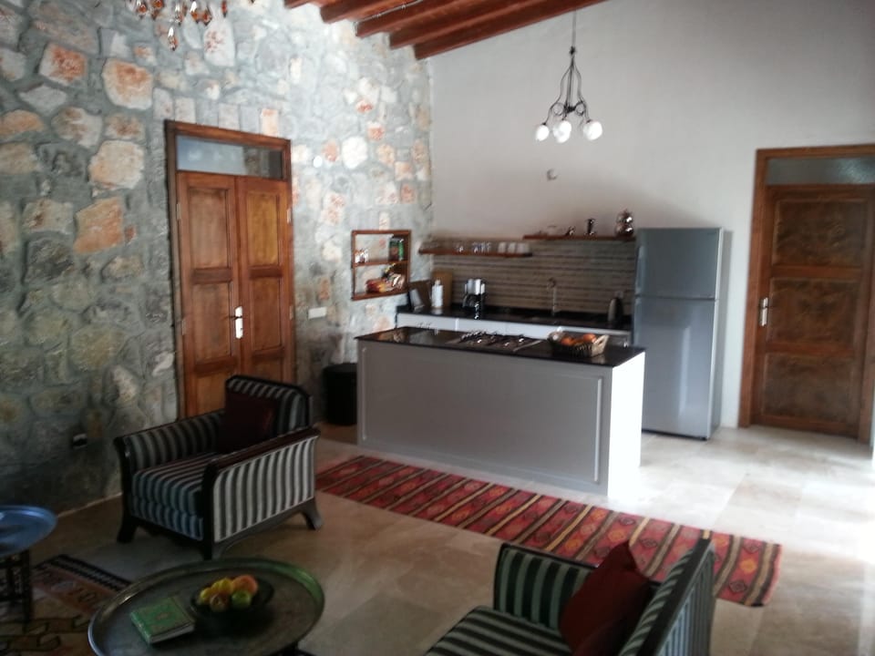 View from the living area to the open fully equipped kitchen