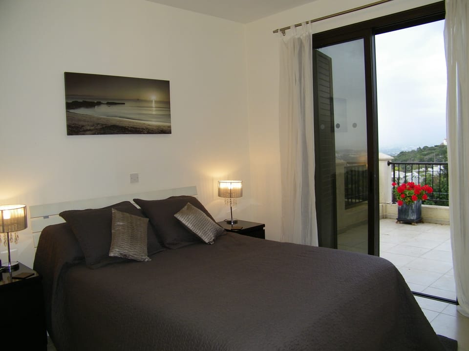 Ground floor bedroom king size with patio and views of sea and mountains