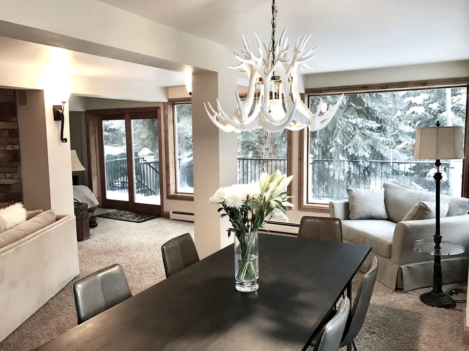 Living and Dining Area. Curl up in 2 oversized corner chairs