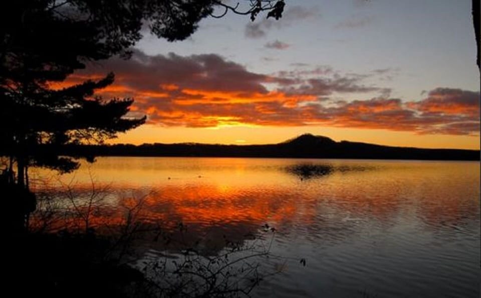 Sunrise over the lake as seen from living room, kitchen and all purpose room.