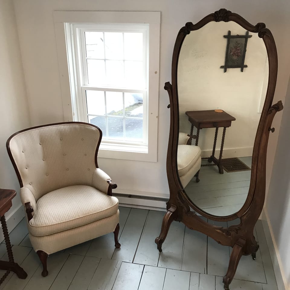 A bright reading / dressing corner in the Church Bedroom.