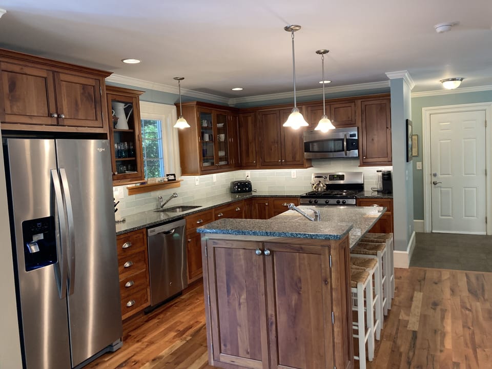 Large kitchen, two sinks, gas stove, granite tops and tile backsplash!