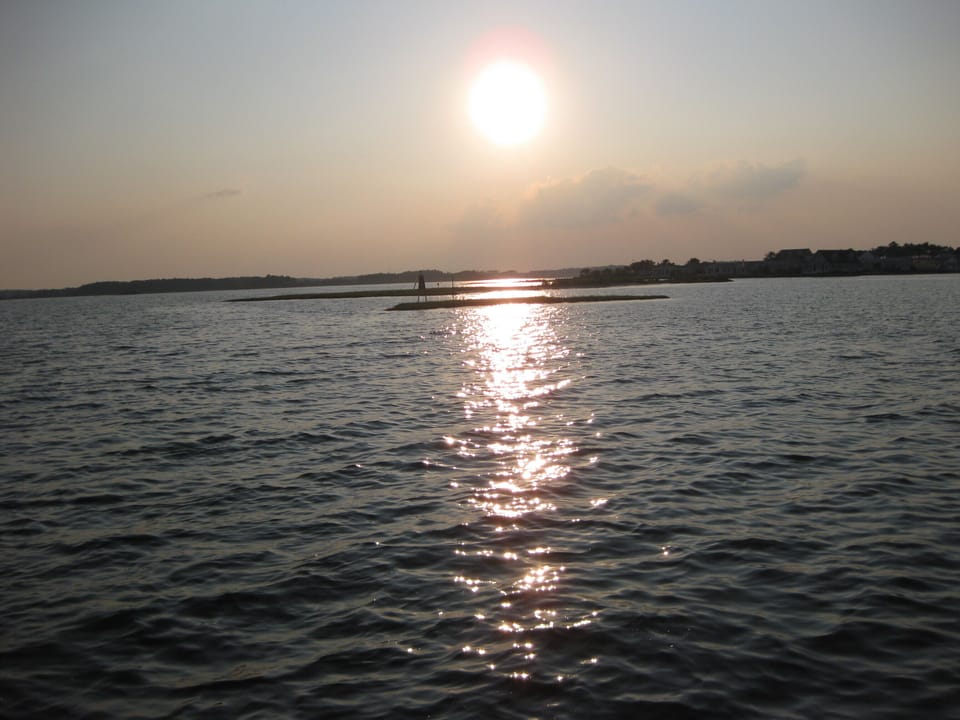 Sun setting over the water--imagine the natural beauty /pictures you can capture