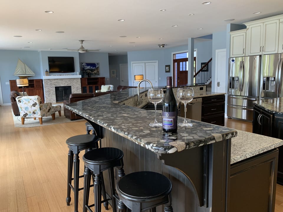 Living room and kitchen looking towards the garage