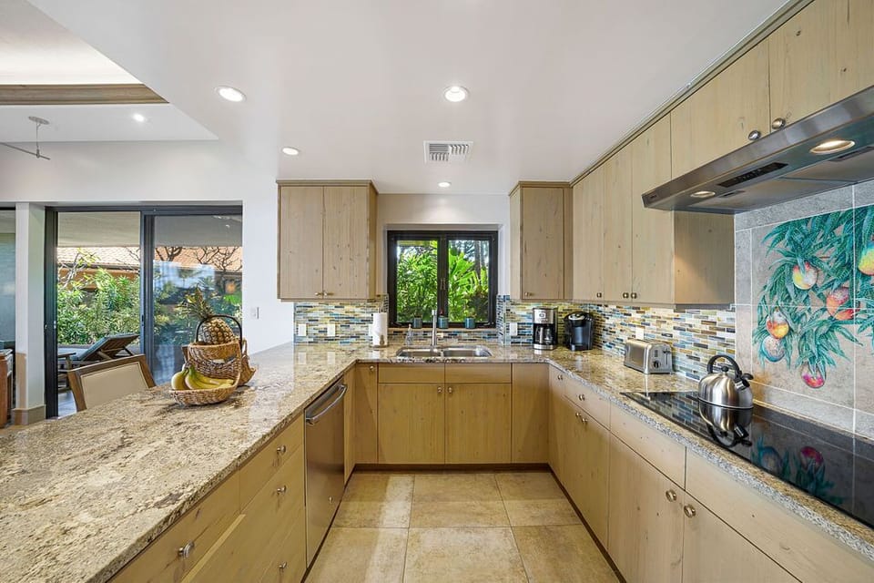 Kitchen with Keurig, toaster, blender & more—perfect for Maui mornings.