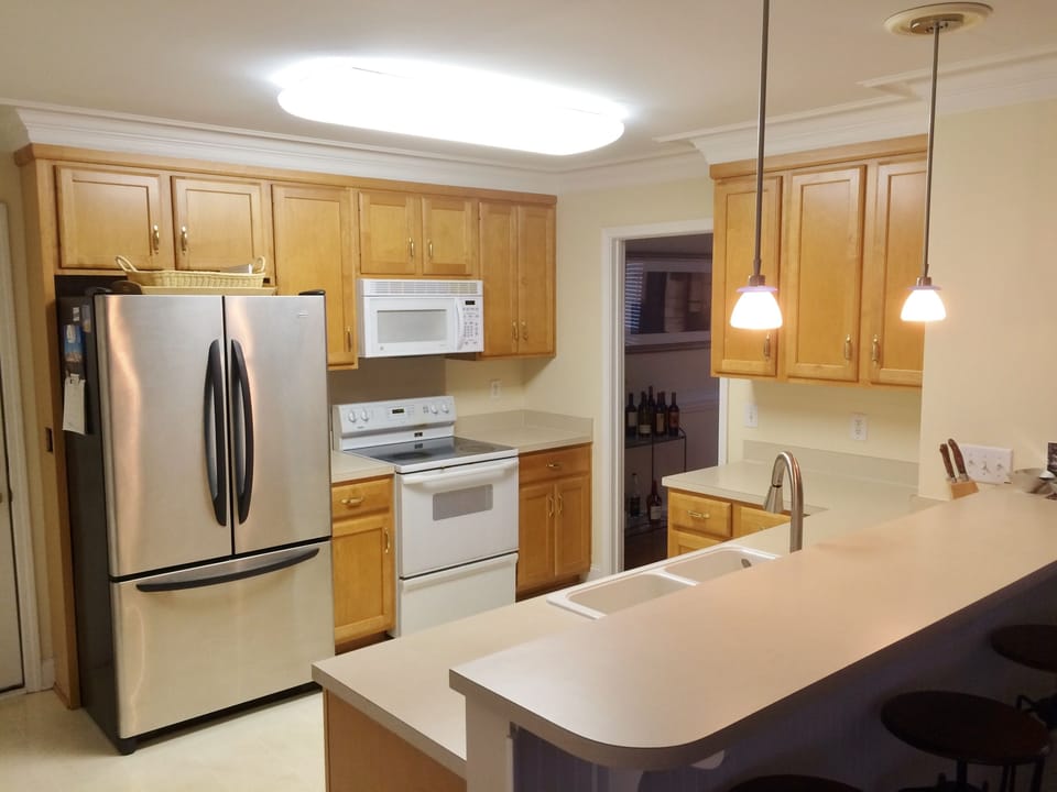 Kitchen, with French door refrigerator, electric range, microwave, dishwasher