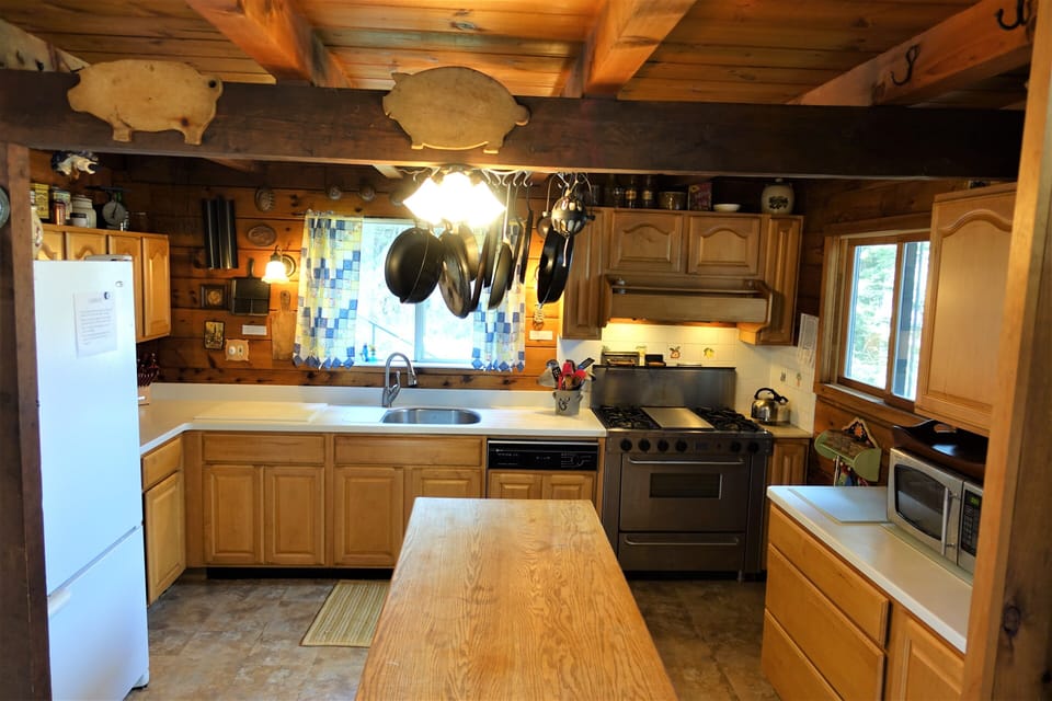 View of very well equipped kitchen, 5-star stove/oven/griddle, Corian counters