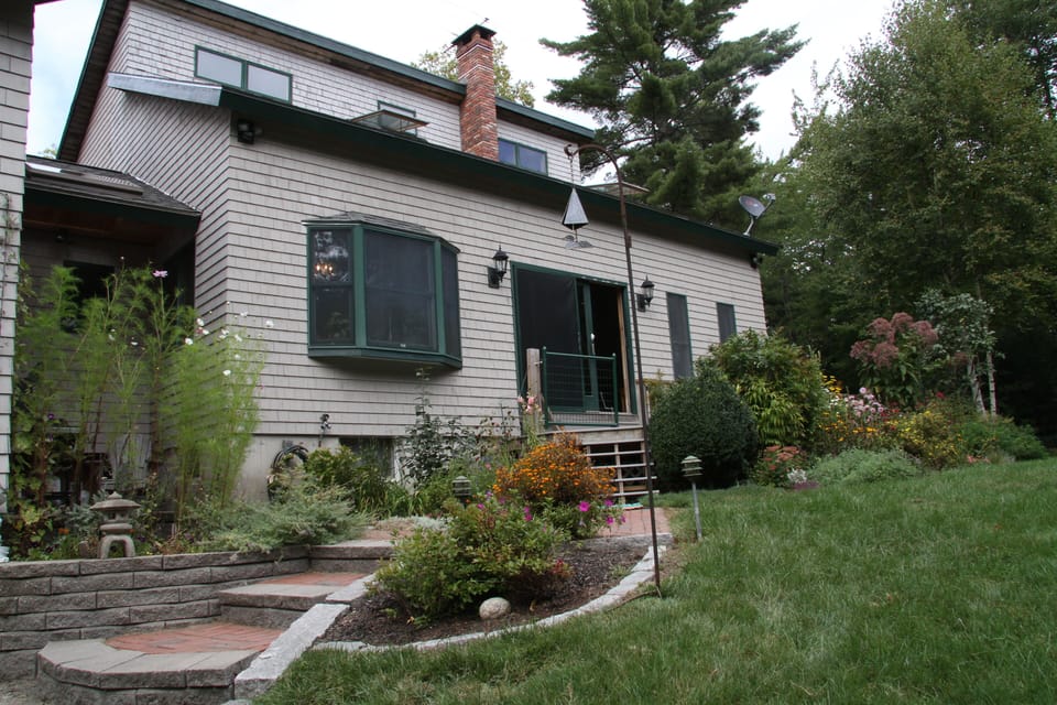 Entrance to House surrounded by gardens