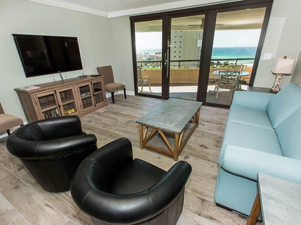 Living room with 55" flat screen TV and view of the Gulf.  