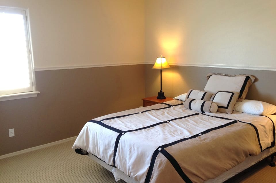 The second bedroom offers a comfortable queen bed and big closet.