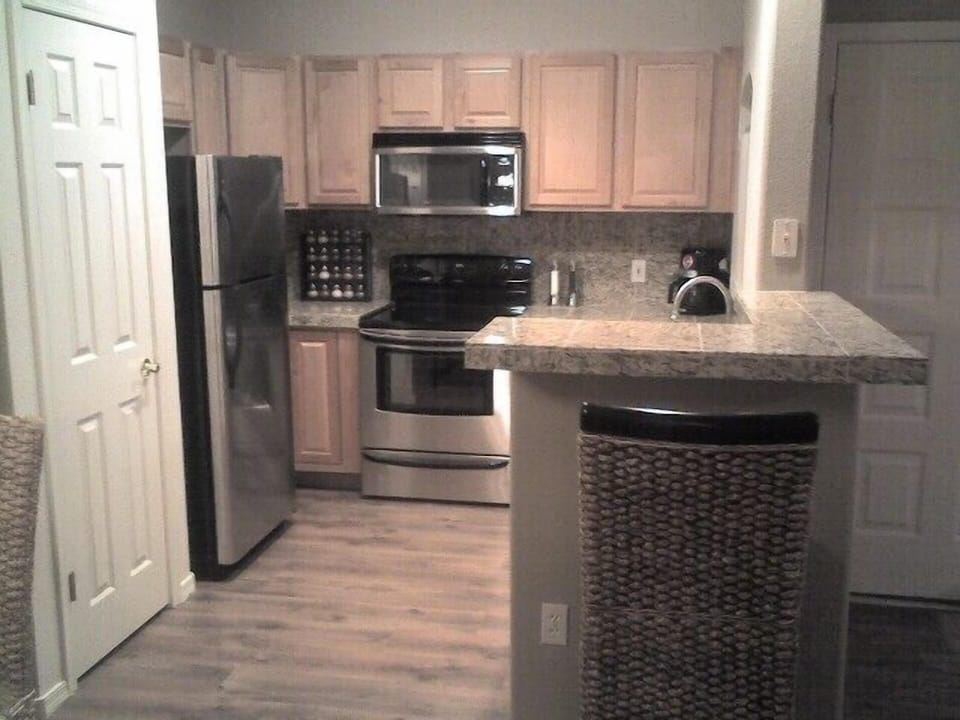 Kitchen w/granite countertops, matching stainless steel appliances