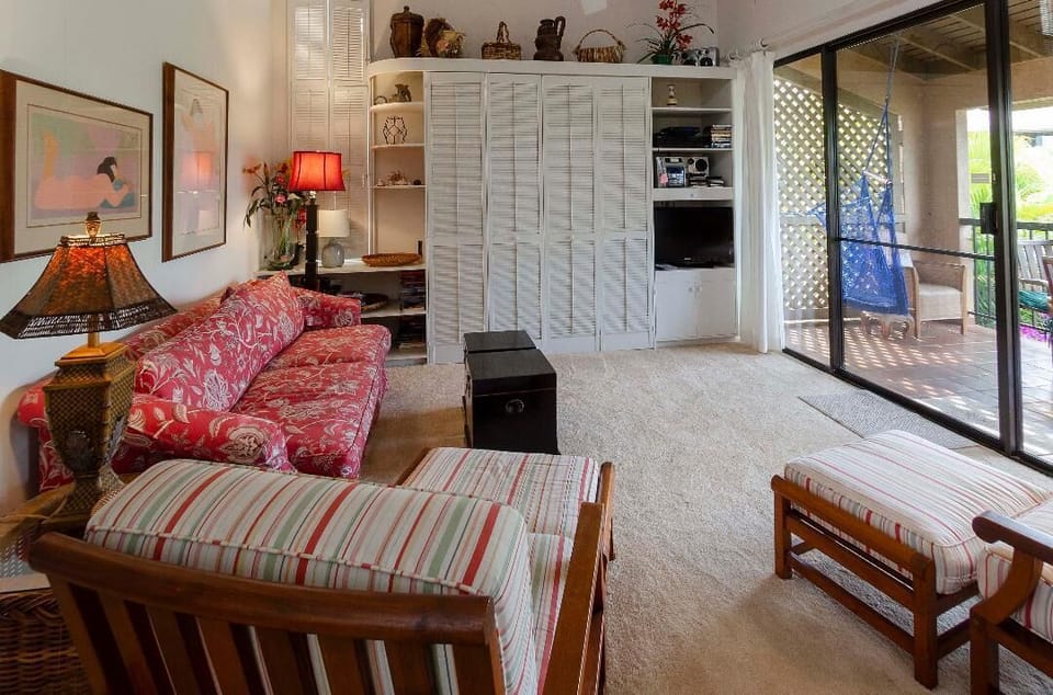 From dining area towards living room, showing Murphy Bed behind the shutters